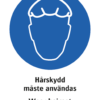 Påbudsskylt med symbol för hårskydd och texten "Hårskydd måste användas" samt på engelska "Wear hairnet".