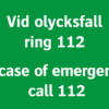 Nödskylt med texten "Vid olycksfall ring 112". "In case of emergency call 112